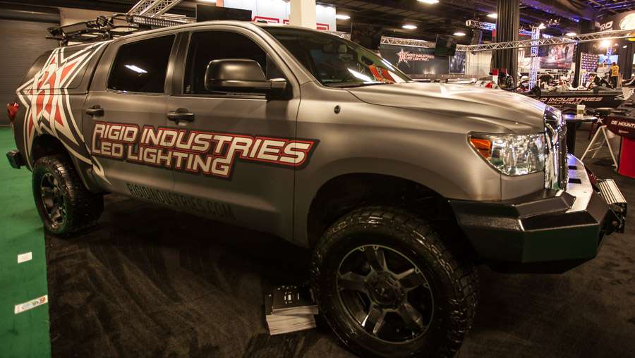 The Rigid Industries Toyota is shining bright in the well-illuminated Rigid booth.
