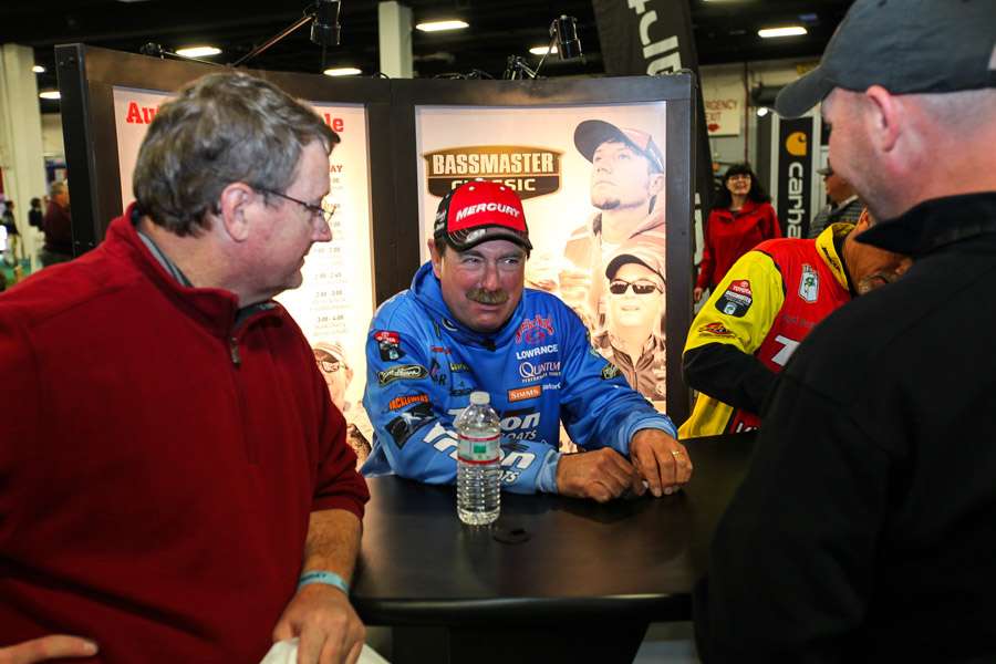 Shaw Grigsby talks about cold-weather fishing with some fans in the Mercury booth.