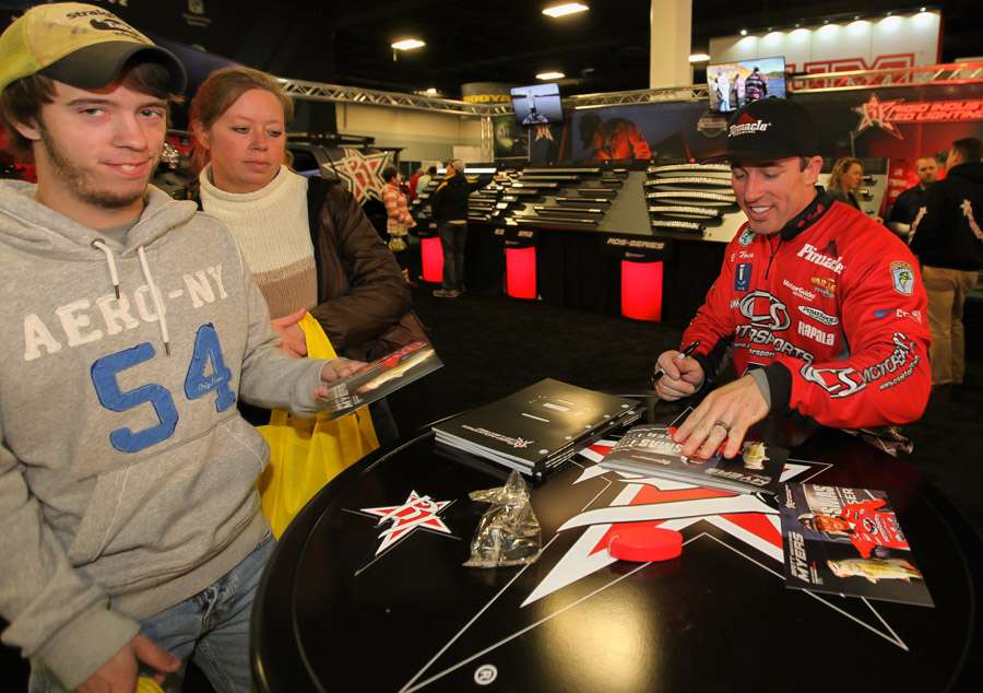 Elite angler Britt Myers signing autographs at the Rigid booth. 