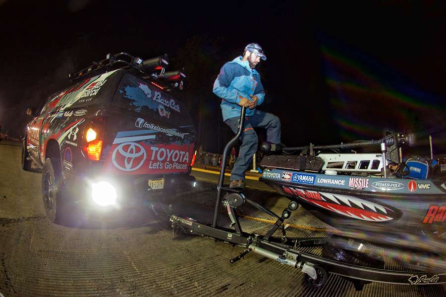 Mike Iaconelli prepares to give his boat a push when it enters the water.