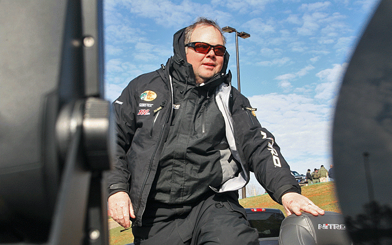 Brian Snowden goes through the check while beginning to shed his cold-weather clothing.