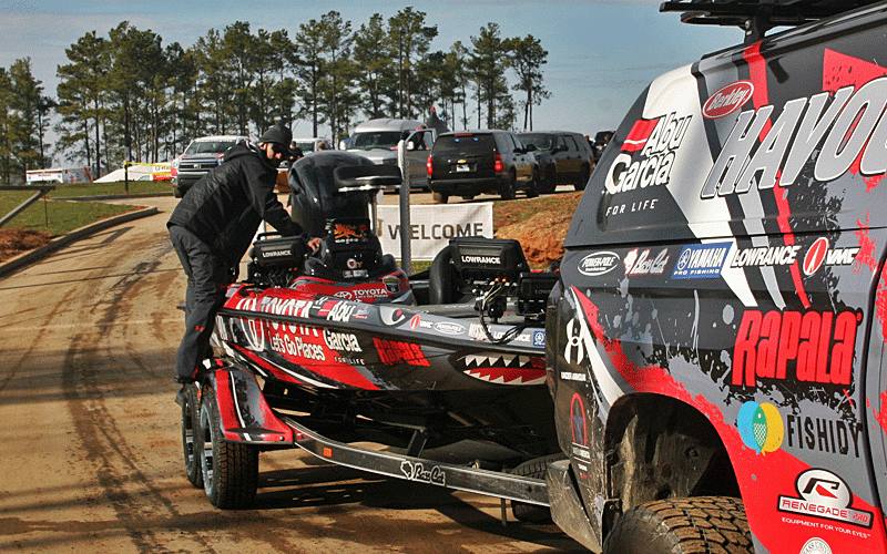Mike Iaconelli hangs on for a short ride from the check station to an area where he secured his gear.