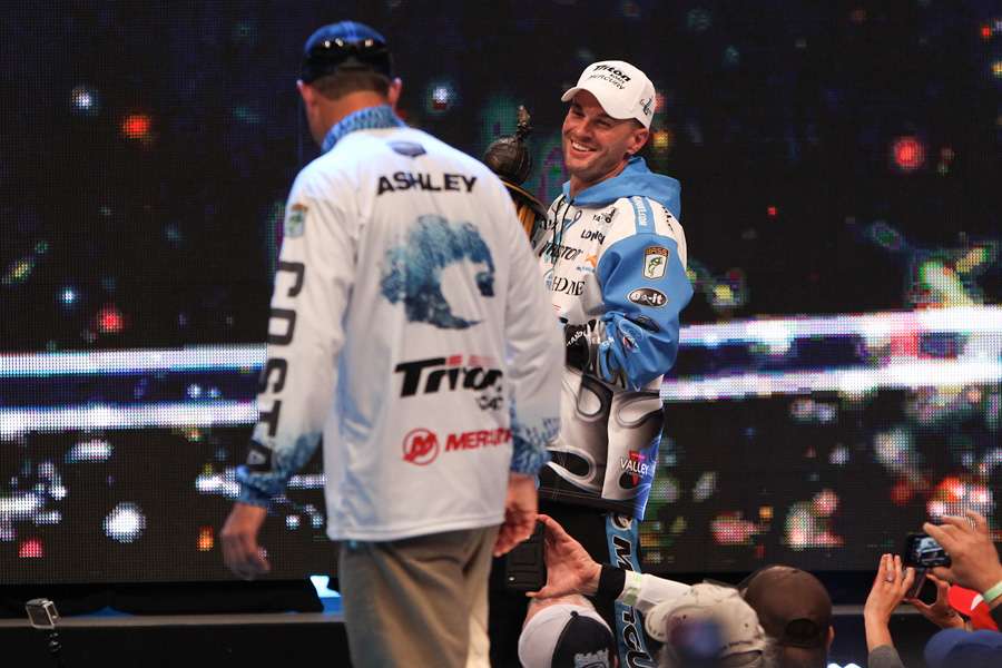 And the 2014 Classic Champion, Randy Howell, hands Ashley the ultimate prize in bass fishing.