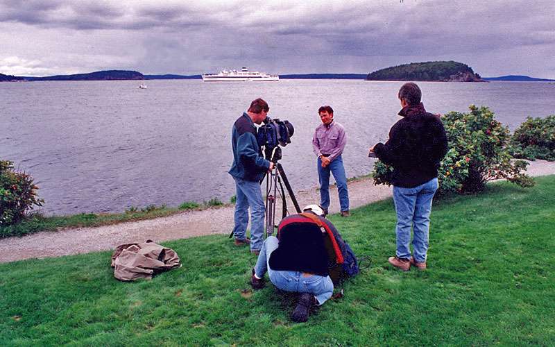 Sanders was hired fulltime at JM in 1990 to do the wraparound segments on the ESPN Outdoors block. Here he shoots a segment from Bar Harbor, Maine.