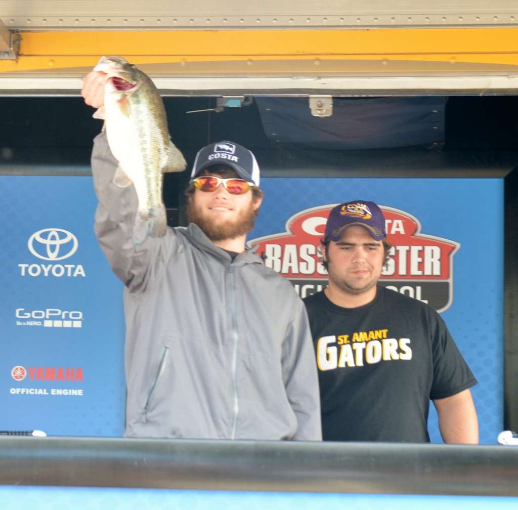 Louisiana anglers Matthew Romano, left, and Nathaniel Pierce brought a nice 4-11 largemouth to the scales. It bit a black-and-blue lizard.