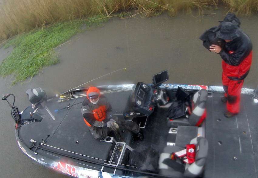 Shaw Grigsby puts a good one in the boat while cameraman Rick Mason stares down the barrel, shooting all the footage live over to the production truck and then out to the world. 