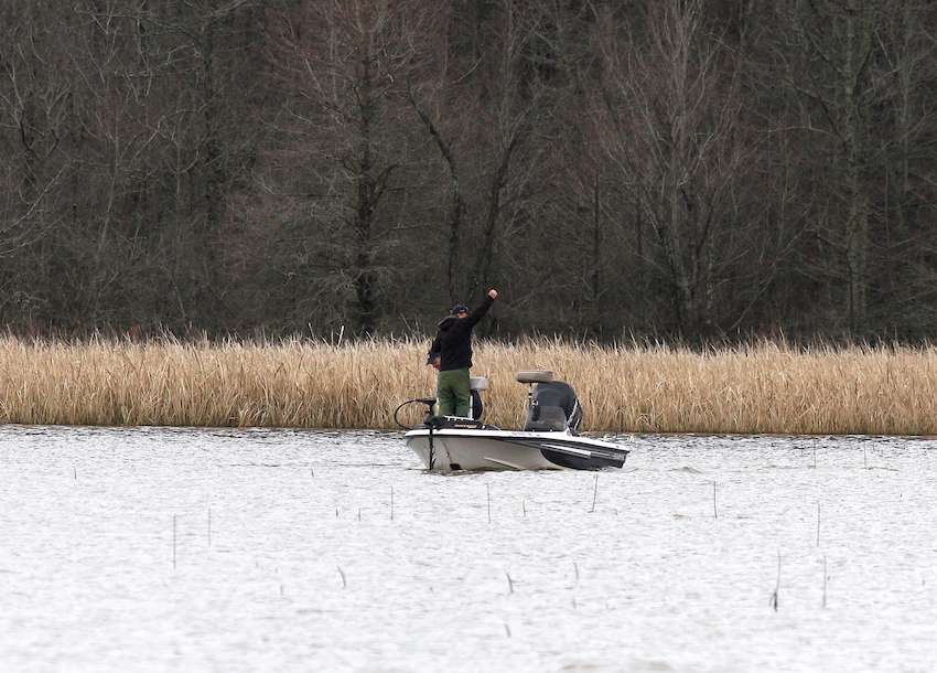 Bishop's co-angler, Gary Sullivan, grabs the fish. 