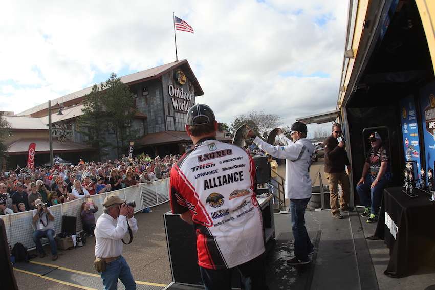 Brainard shows his fish off to the crowd at Bass Pro Shops. 