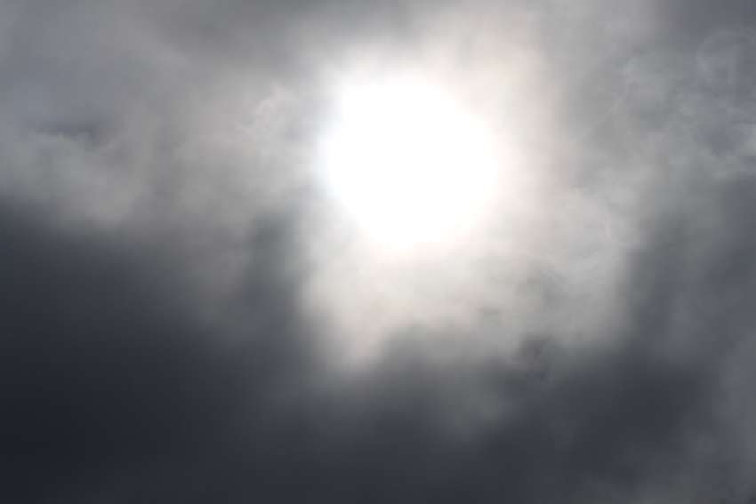 The sun fights to pop out from behind the clouds. 