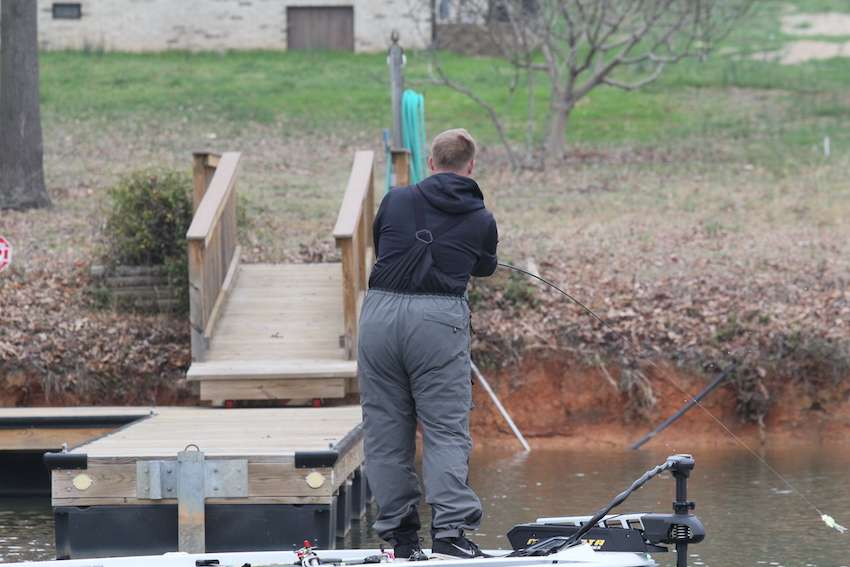 Whittaker lays a cast down a shallow dock. 