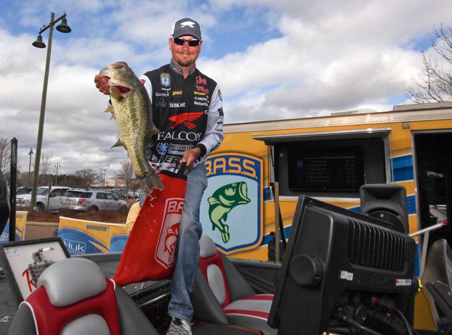 Jason Christie was the first pro to weigh in and pulls his best of the day from the livewell. 