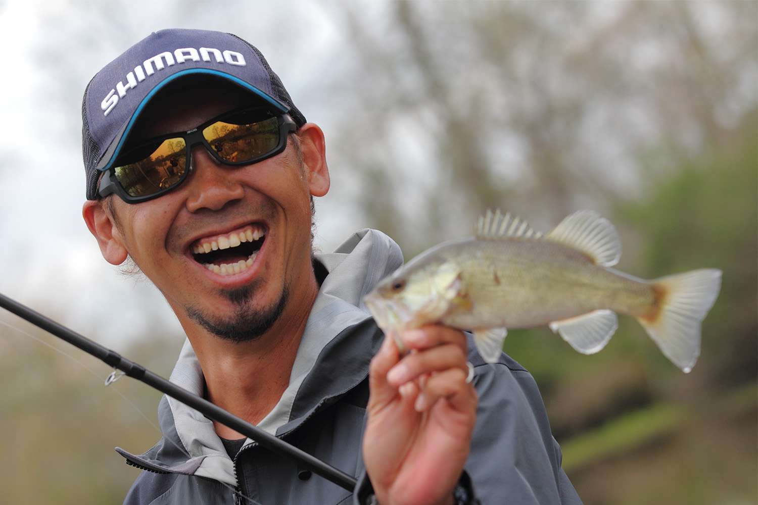 Iyobe's signature smile with a baby bass.