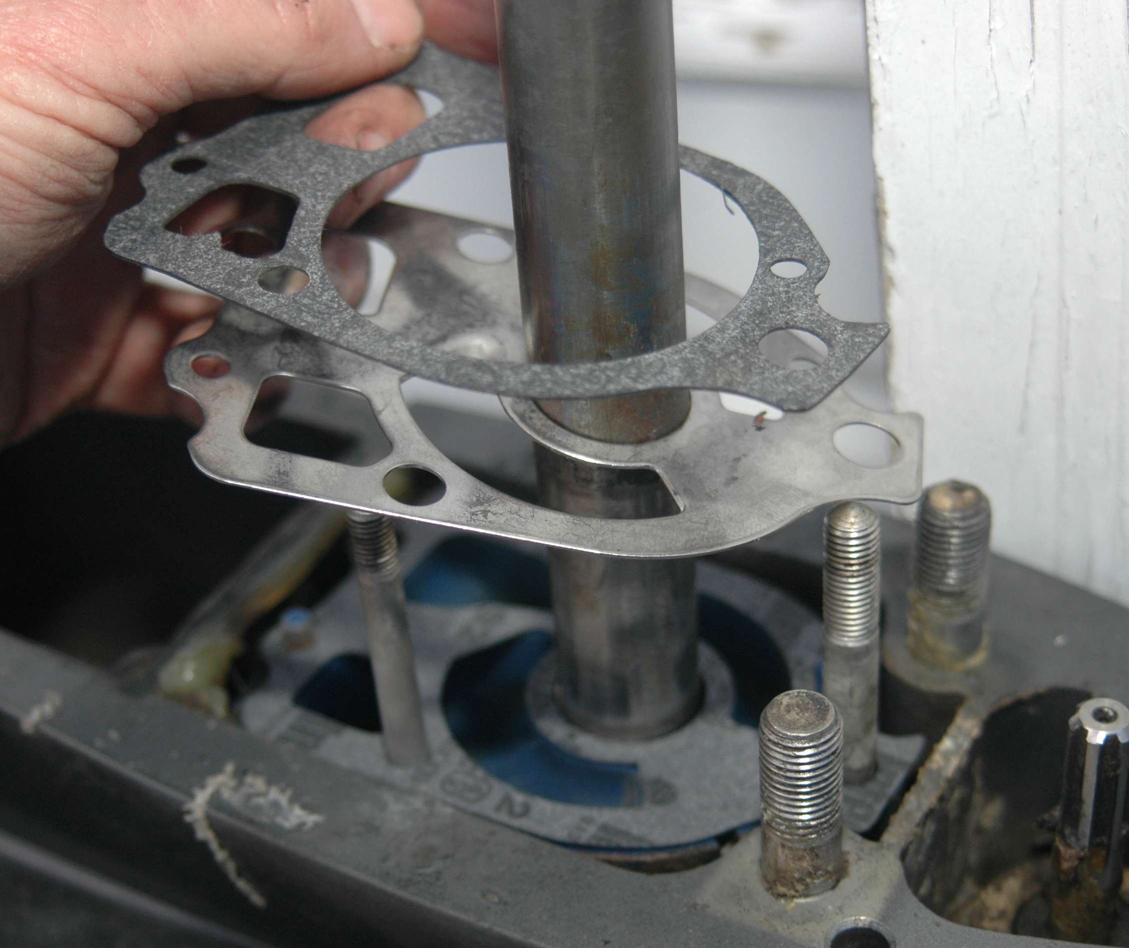 <em>REBUILDING THE WATER PUMP</em>
<br>Remove and replace any gaskets between the water pump housing and its base. I bought a kit at my local marine dealer that had everything I needed. The kit cost only $5 more than the impeller alone.