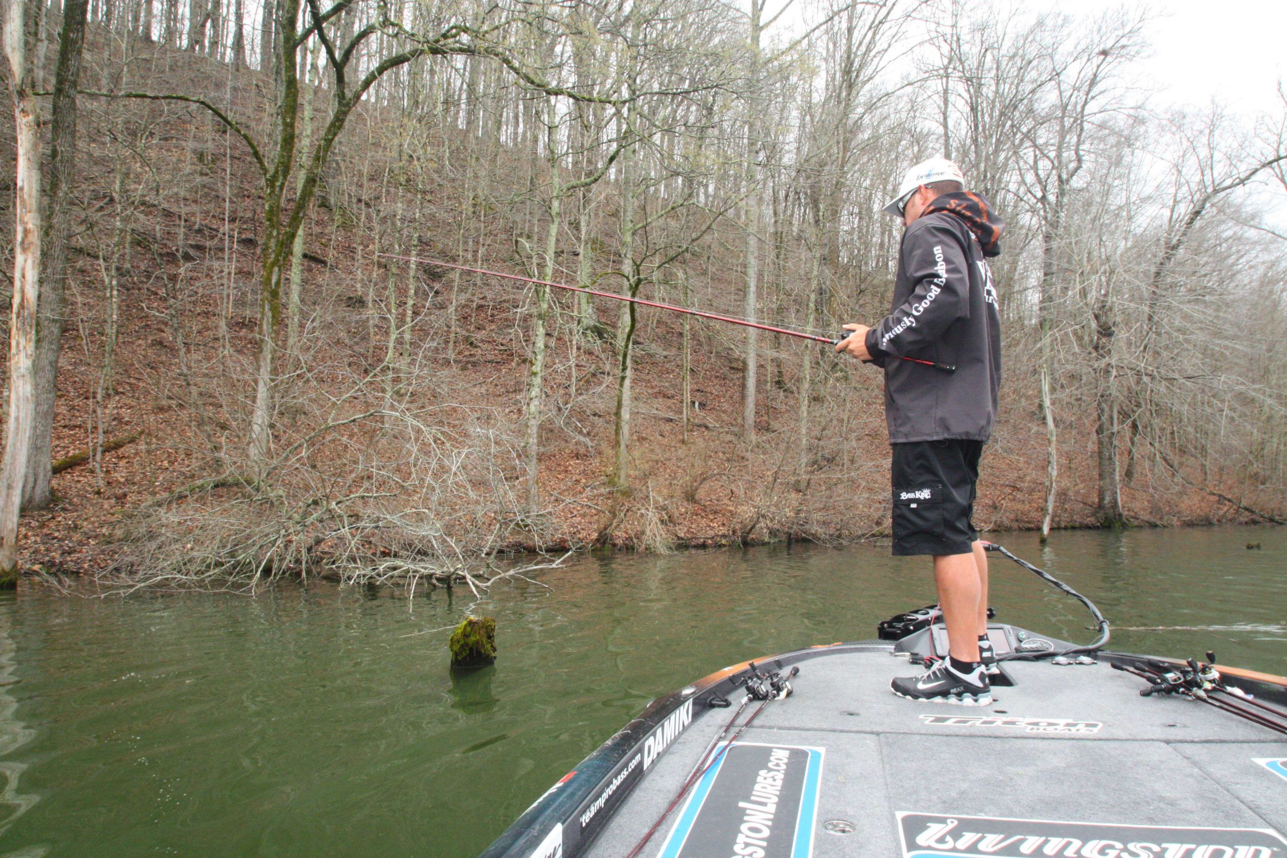 10:51 a.m. Cherry fishes a jig on a steep channel bank lined with submerged timber.