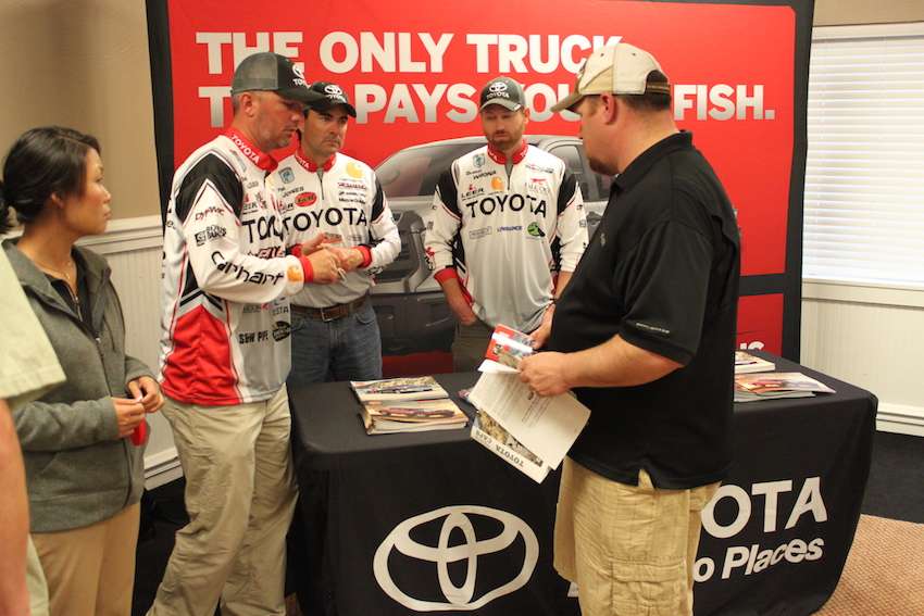 Team Toyota talks with the anglers as they make their way through registration. 