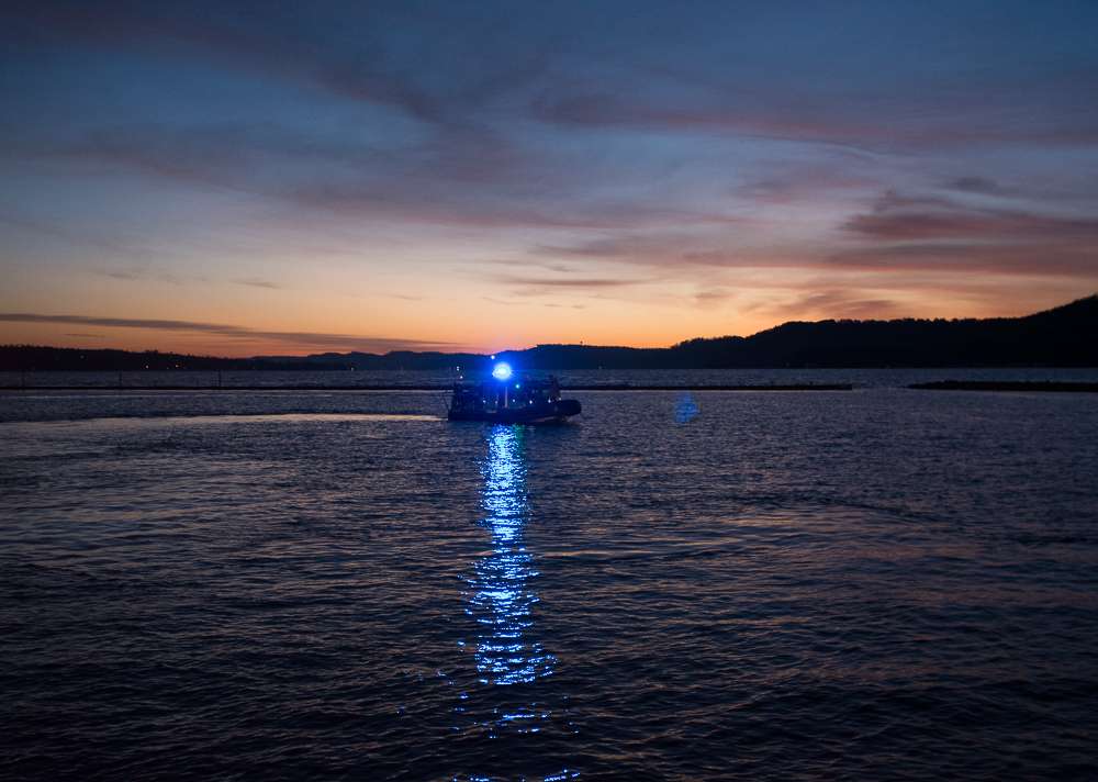 A police boat floats through the area.
