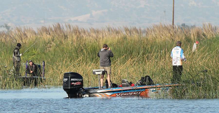 And anglers start filtering into the marsh. Tucker is in the foreground, while Aaron Martens is to the left and Keith Combs is to the right.