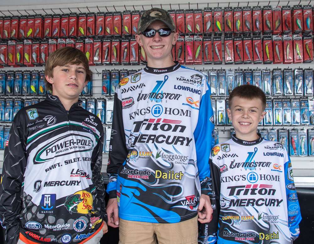 Cal Lane, Laker and Oakley Howell are hanging out in the Livingston Lures booth. 