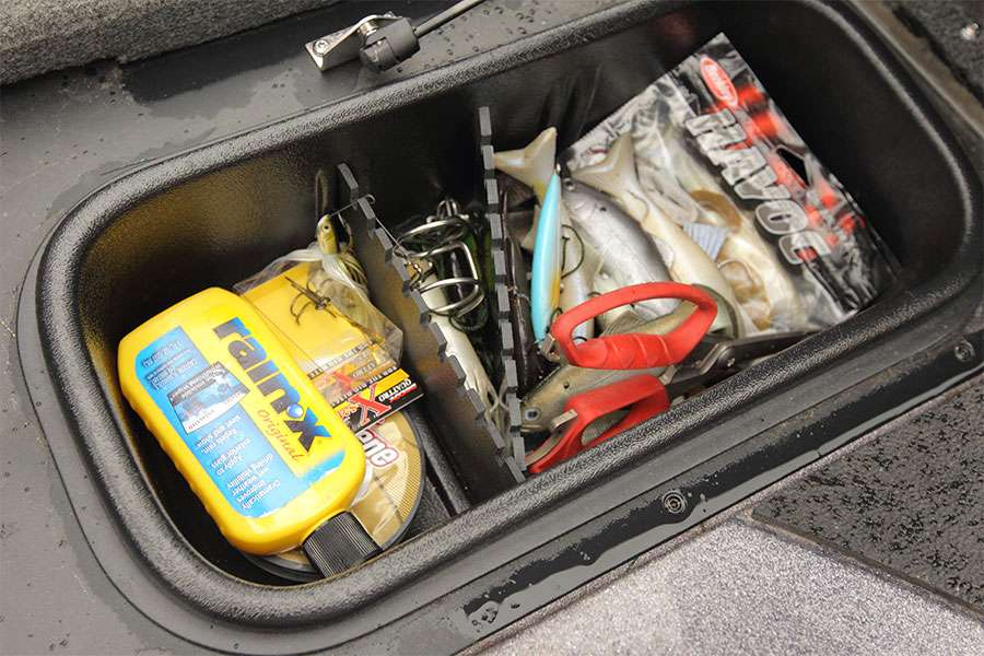 In this little box are a few extra Huddleston swimbaits, Havoc plastics, Buck Splizzors, a lure knocker and some hooks and line. The Rain-X is to keep water from beading up on his GoPros.