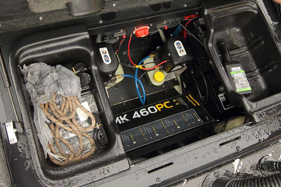 In his battery box are Power-Pole pumps, a Minn Kota Precision Charger, some rope for tying up to things, Power-Pole remotes and switched and Yamalube Ring Free Plus fuel additive for treating ethanol.