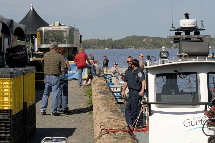 Behind the scenes, there's a police boat, the boats that return the bass to Lake Guntersville and operations trailers.