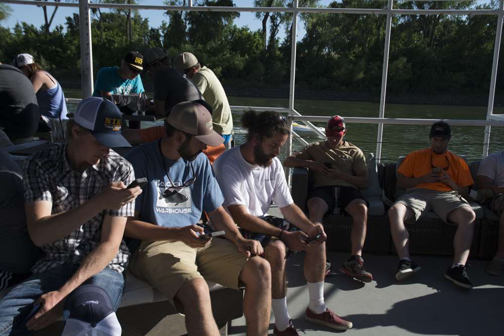 It may look like the anglers are texting ...