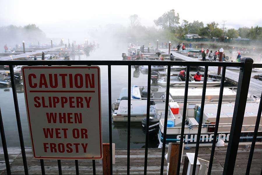 This sign means what it says. The dock is slick and covered in frost, just like the decks of boats. 