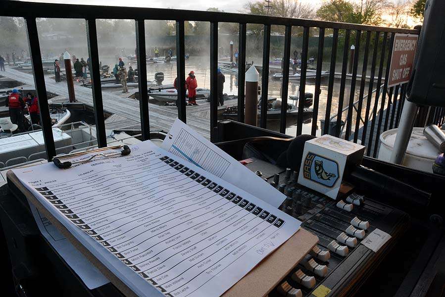 The clipboard with angler pairings and the microphone are idle as music plays during the fog delay. 