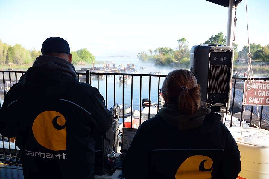 B.A.S.S. Nation Director Jon Stewart and coordinator Emily Hand watch from the weigh-in site as the final boats take off.