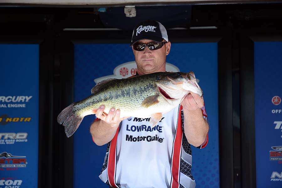 New Mexico angler Dave Kromm poses with a largemouth weighing 9-12. The bass is the biggest caught of Day One. 
