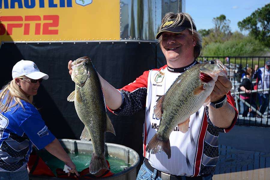 Brian Day with two bass that helped boost the overall weight of the winning state team. 