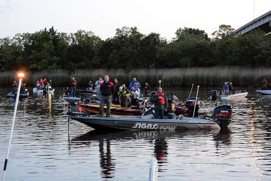 The anglers pay tribute to the nation as the boats float across the Little Pee Dee River. 