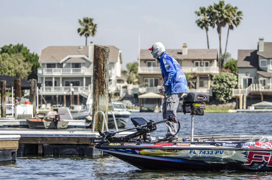 Back in the marina, Shaw Grigsby is fishing docks.