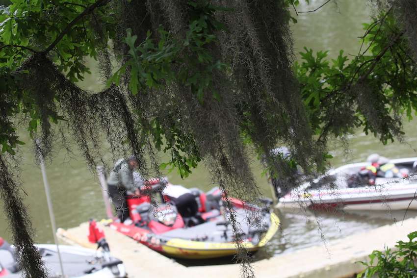 Guy Eaker gets ready to load his fish under the Spanish moss. 