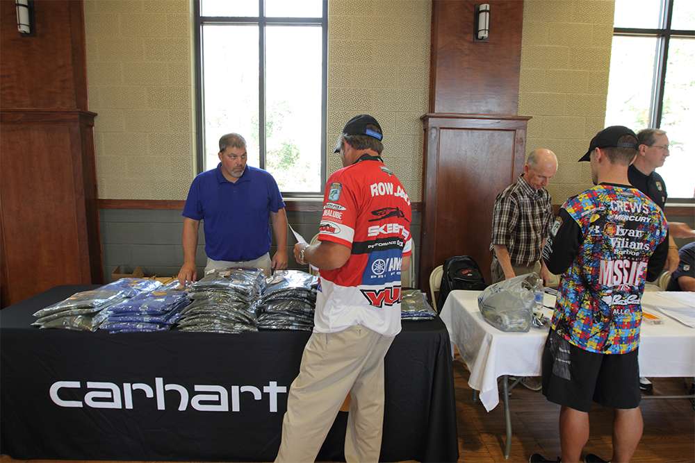 Anglers receive Carhartt clothing as they go through the registration line.
