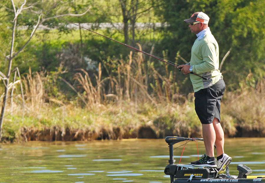 Bobby Lane was standing on his trolling motor bracket looking at a fish on a bed. 