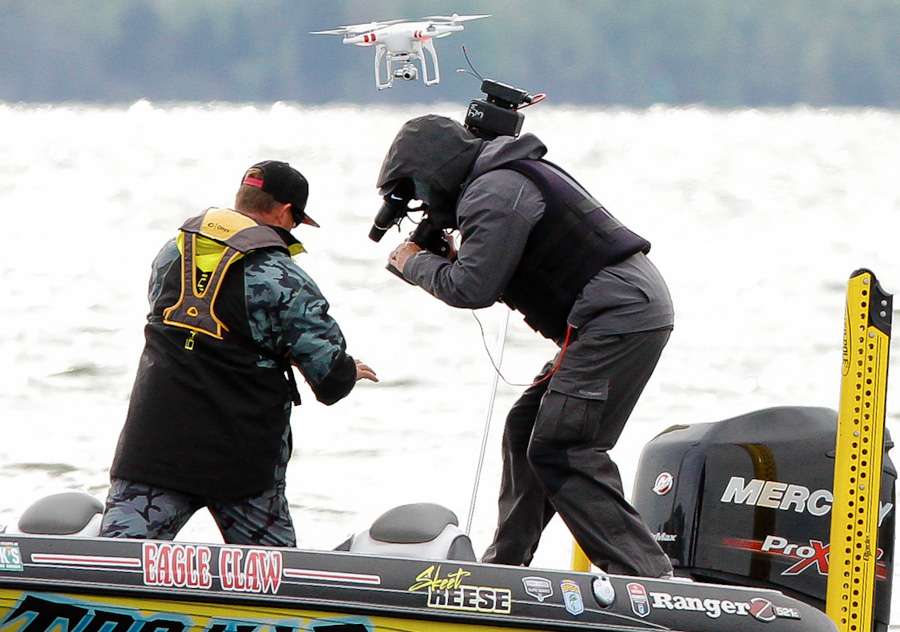 Skeet shows Wes Miller his torn up hands from catching so many fish this week. The drone got a good look at them, too. 