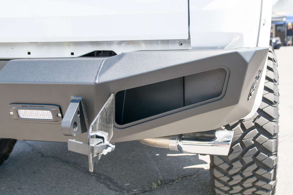 Two lockable storage compartments allow you to hold tow straps, a receiver hitch, your wallet...anything. It is also set up for some Rigid Industries SRQ lights you can see on the left. 