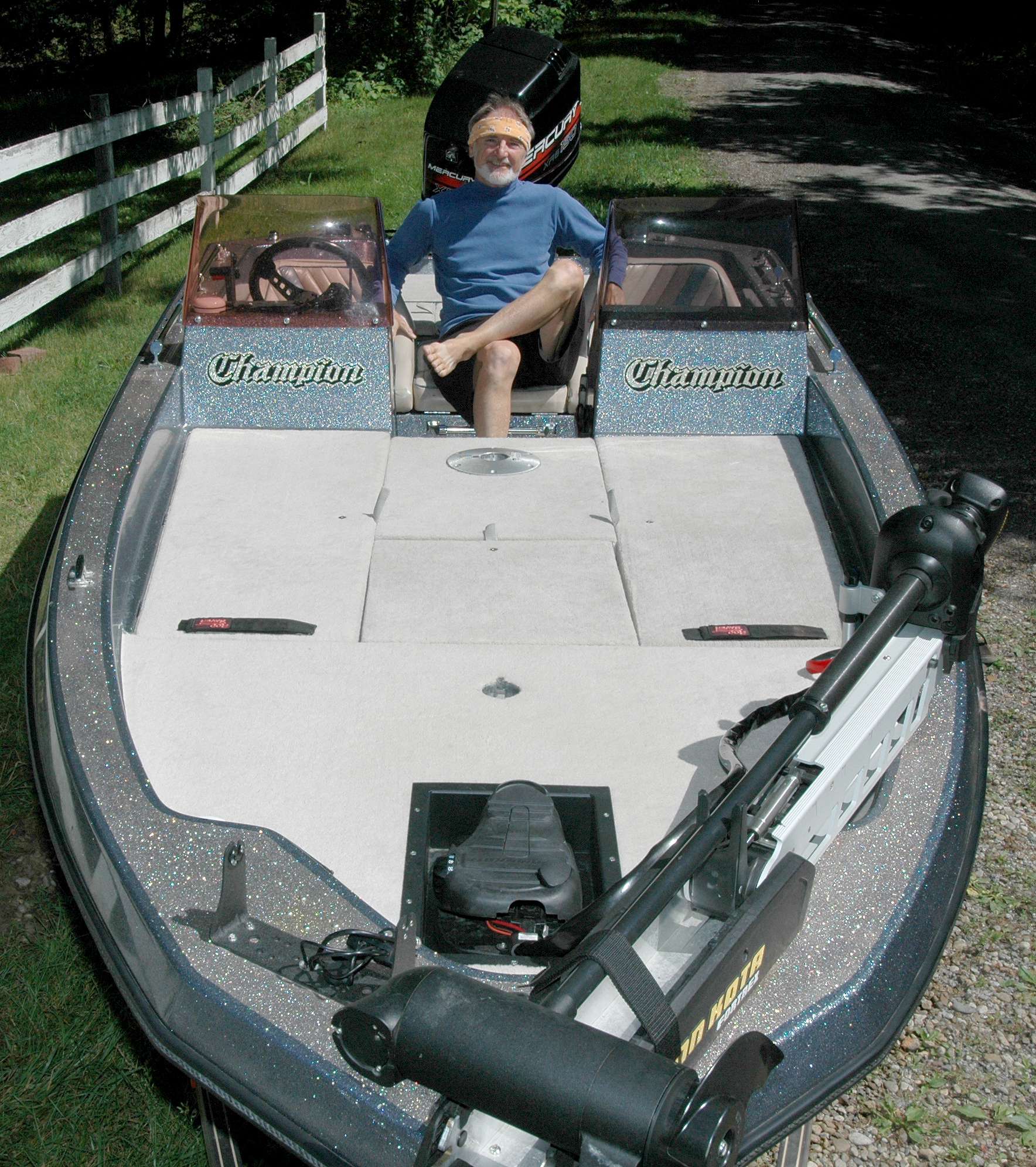I pose in my bass boat after installing new marine-grade carpeting and recessed trolling motor pedal inset. I'm whipped but proud and happy.