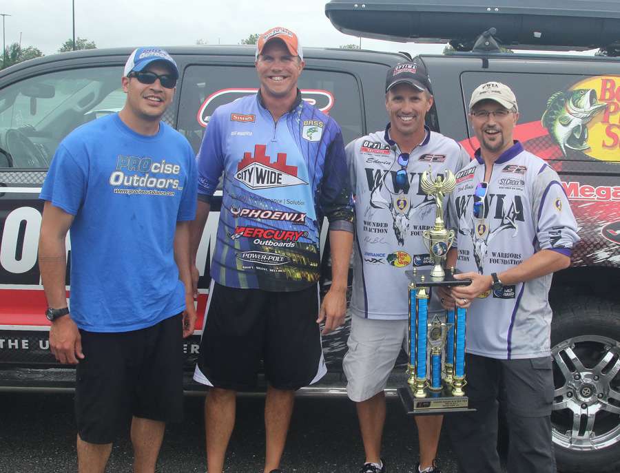 The four anglers gather around Evers' truck for the trophy presentation.
