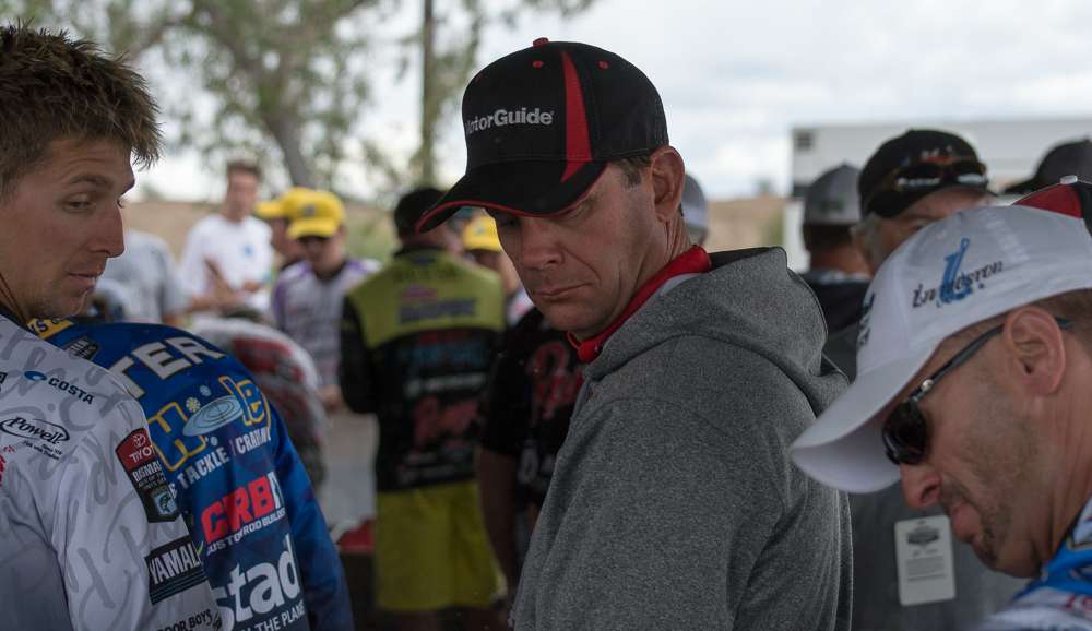 Chad Pipkens and Kevin VanDam watch Randy Howell's fish thrash about.