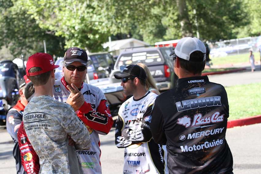 Anglers share stories while they wait for weigh-in bags.