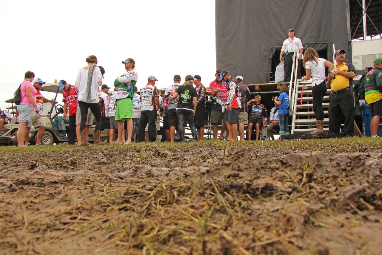 A mix of B.A.S.S. and FLW anglers, along with their friends and families, tiptoed through the mud backstage at the weigh-in. 