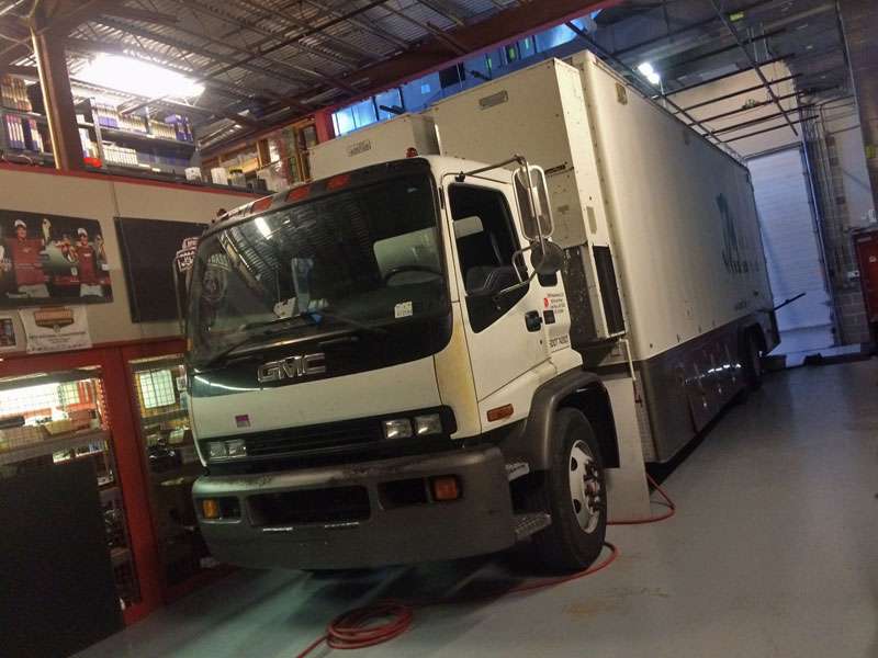 The JM production truck, which usually is at the weigh-in site for Elite events, sits inside the quiet garage.