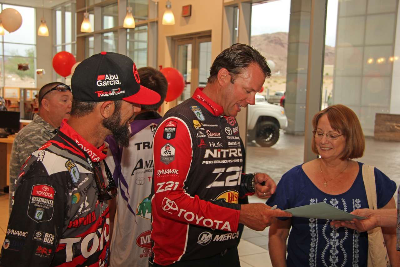 Iaconelli and KVD smile over a piece of memorabilia a fan brought to share with them.