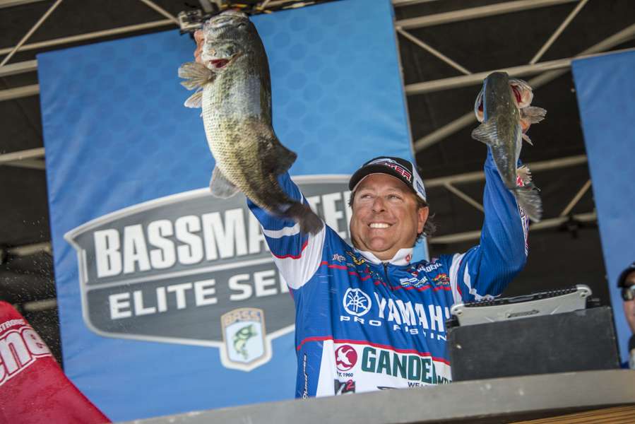 Dean Rojas pulls a big set of fish out of his weigh-in bagâ¦