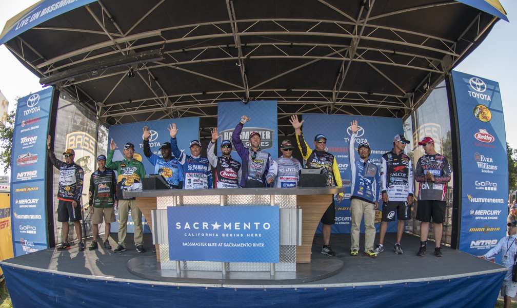 The top 12 anglers fishing on Championship Sunday line up for a photo opportunity.
