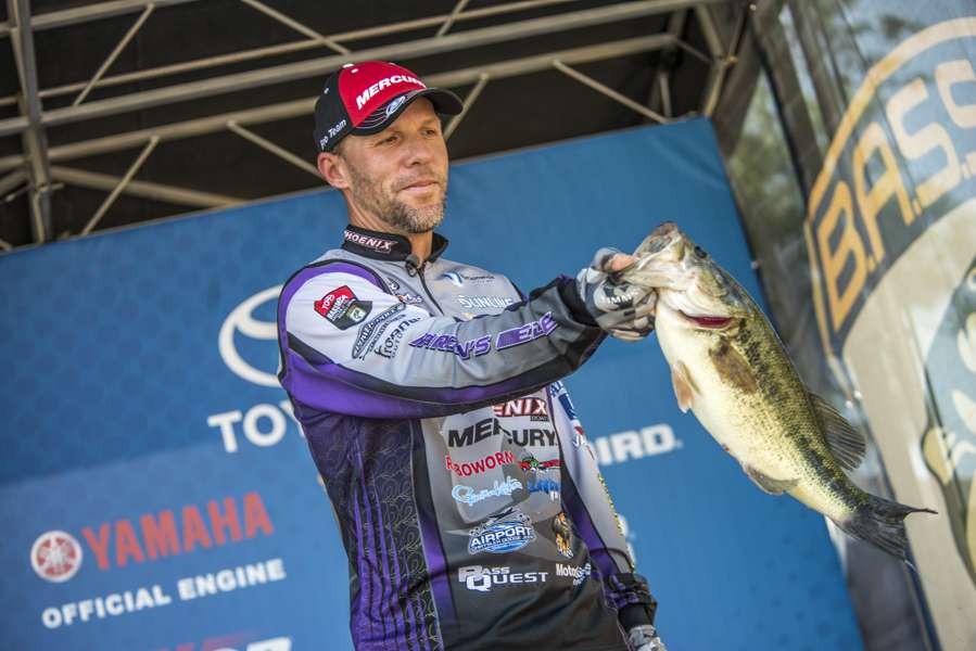 Aaron Martens hold up his biggest fish. 