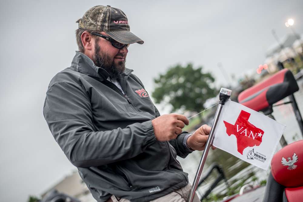2014 Toyota Bassmaster Angler of the Year Greg Hackney ties a flag on his light pole. 