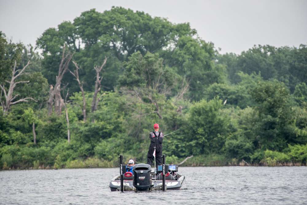 Out on the lake Combs is set up on a hump that he is fishing with several different baits including a Strike King 10XD. 